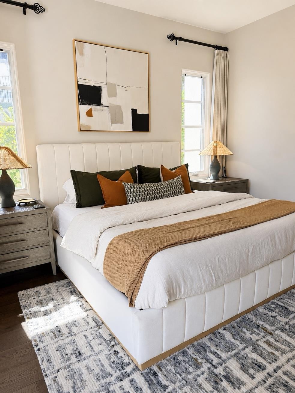 Bedroom with upholstered bed and abstract art at The Nineteenth