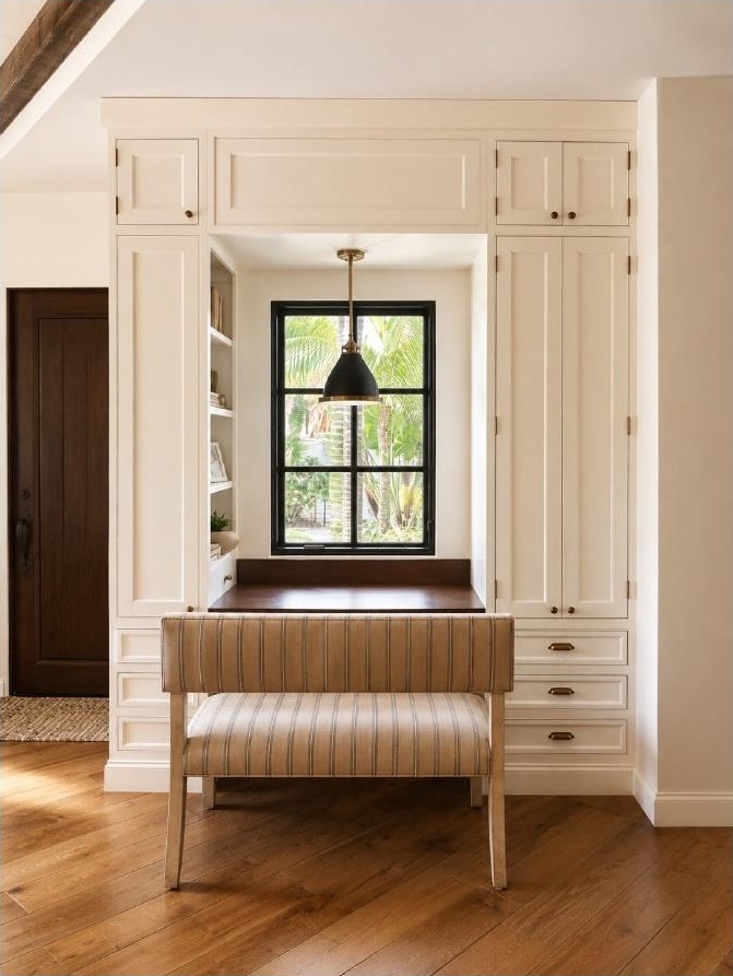 Built-in window desk nook with striped chair