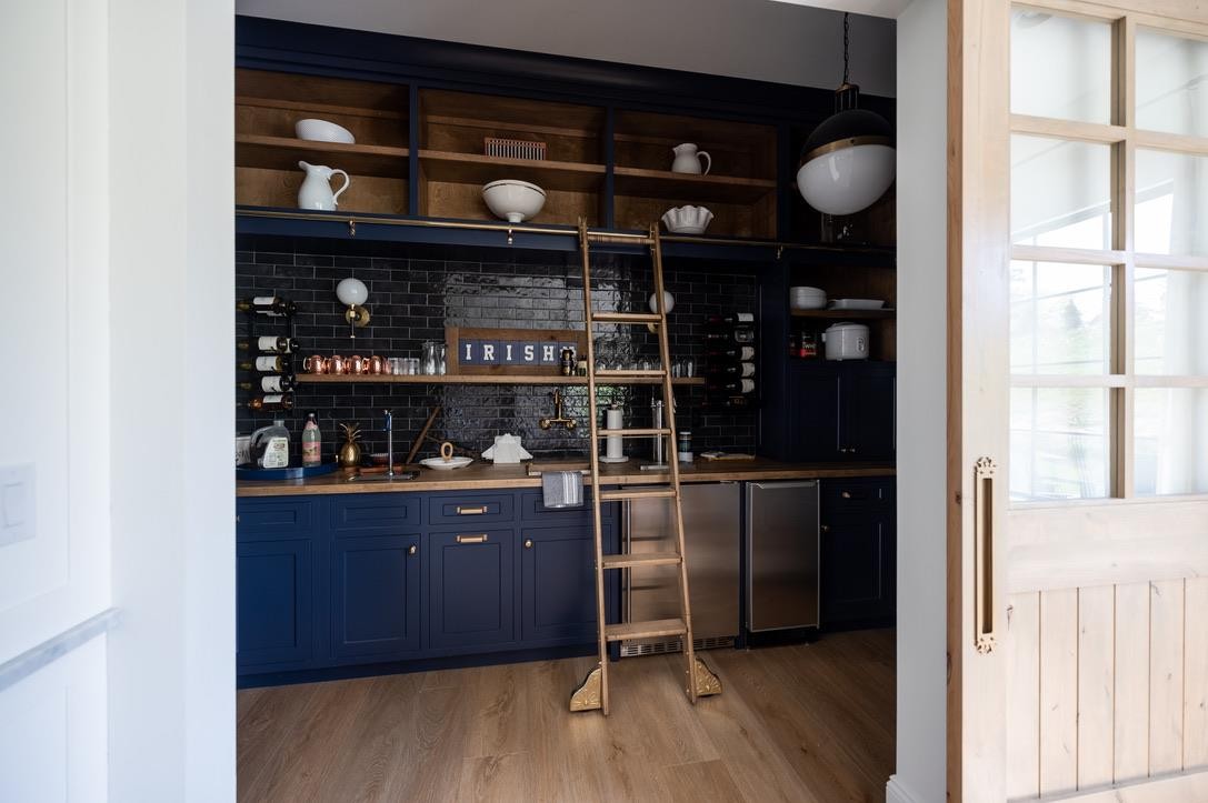 Navy built-in bar with brass ladder at The Shamrock House
